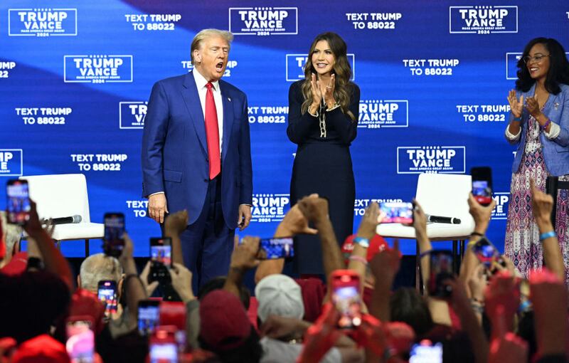 Donald Trump and then-South Dakota Governor Kristi Noem participate in a joint town hall in Philadelphia during the 2024 campaign.