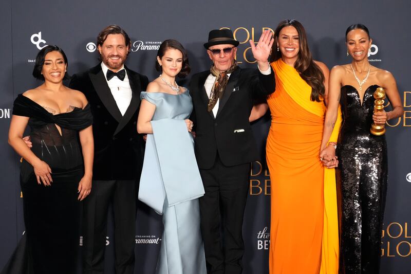 BEVERLY HILLS, CALIFORNIA - JANUARY 05: (L-R) Adriana Paz, Edgar Ramírez, Selena Gomez, Jacques Audiard, Karla Sofía Gascón, and Zoe Saldana, winners of the Best Motion Picture - Musical or Comedy award for “Emilia Pérez,” pose in the press room at the 82nd Annual Golden Globe Awards at The Beverly Hilton on January 05, 2025 in Beverly Hills, California.  (Photo by Jeff Kravitz/FilmMagic)