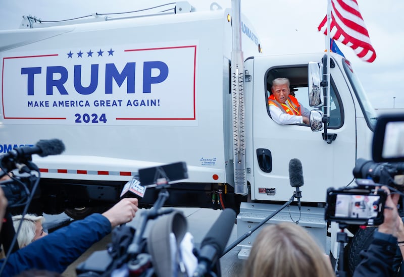 Republican presidential nominee, former President Donald Trump holds a press conference from inside trash hauler at Green Bay Austin Straubel International Airport on October 30, 2024 in Green Bay, Wisconsin.