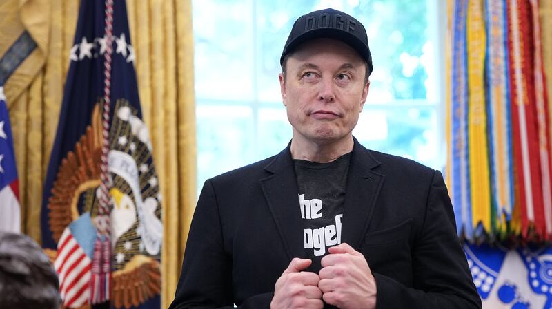 Elon Musk, sporting a black eye given to him by his son X, listens as President Donald Trump speaks to reporters in the Oval Office of the White House on May 30, 2025.