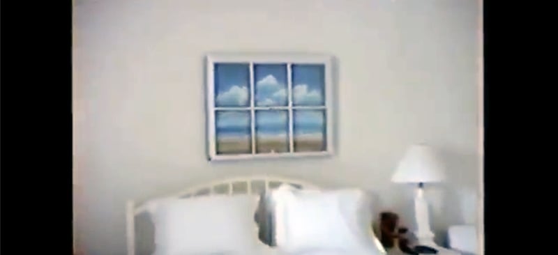 Artwork featuring a twee beachy scene in a bedroom at Jeffrey Epstein's Palm Beach mansion.