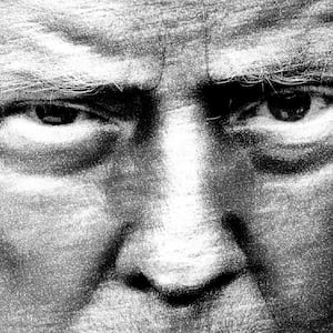 Black and white close up photograph of Donald Trump with an intense stare