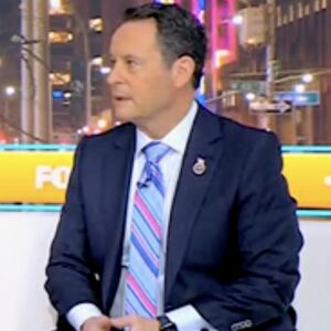 Fox & Friends co-hosts Lawrence Jones, Ainsley Earhardt and Brian Kilmeade talk during the December 9, 2024 broadcast of the show.
