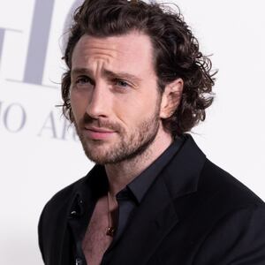 Aaron Taylor-Johnson on a red carpet.