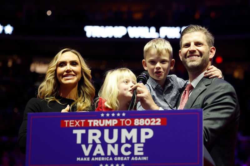 Eric Trump, right, and Lara Trump, left, with children Carolina and Luke.