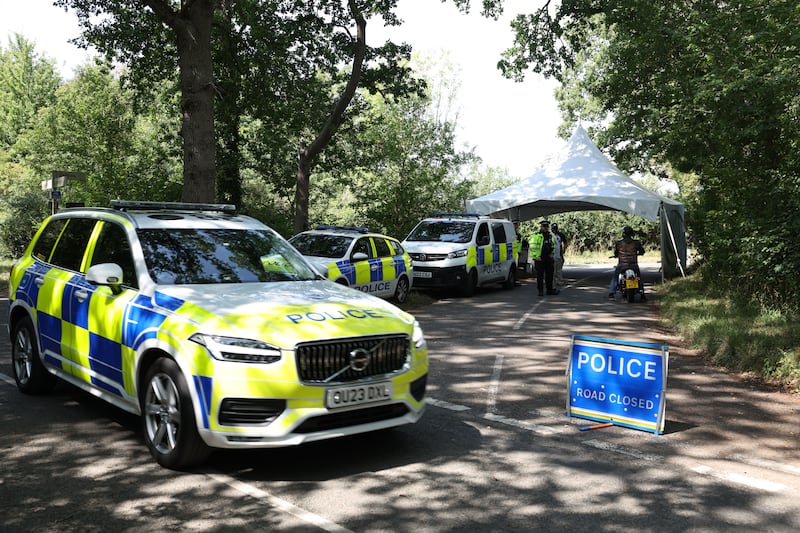 TOPSHOT - A police road block is in operation, filtering access to the village of Dean, three miles north of Charlbury, west of London on August 12, 2025, as the US Vice President JD Vance takes his vacation in the English countryside. Vance and his family are holidaying in the UK and are expected to spend some time in the Cotswolds region of southern England. (Photo by Darren Staples / AFP) (Photo by DARREN STAPLES/AFP via Getty Images)