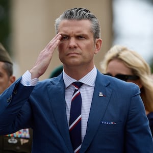Secretary of Defence Pete Hegseth salutes during a ceremony at the Normandy American Cemetery to mark the 81st anniversary of the D-Day landings during World War II on June 06, 2025 in Colleville-sur-Mer, France.