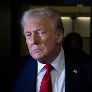 US President Donald Trump speaks to members of the press while returning to Washington, DC on Air Force One on March 30, 2025, in Fredericksburg, Virginia. (Photo by Brendan Smialowski / AFP) (Photo by BRENDAN SMIALOWSKI/AFP via Getty Images)