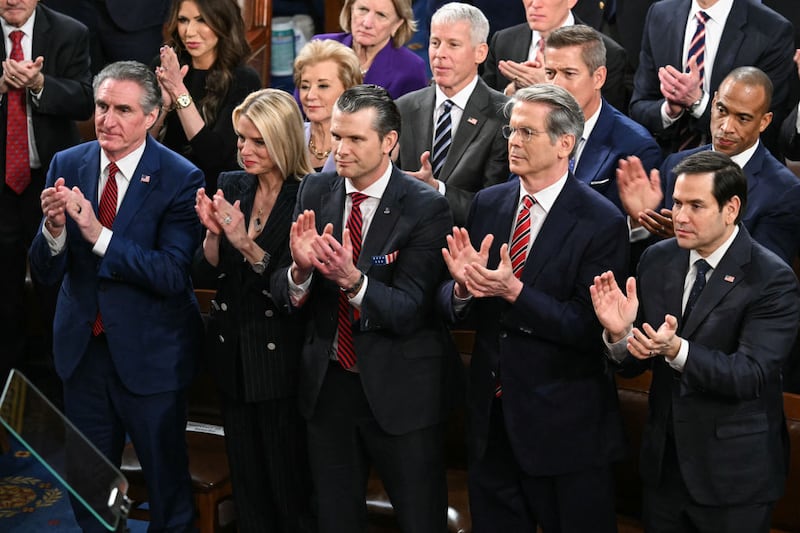 (L-R) Cabinet members US Secretary of the Interior Doug Burgum, Attorney General Pam Bondi, Defense Secretary Pete Hegseth, Secretary of Treasury Scott Bessent and Secretary of State Marco Rubio stand and applaud as US President Donald Trump speaks during an address to a joint session of Congress in the House Chamber of the US Capitol in Washington, DC, on March 4, 2025.
