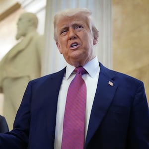 President Donald Trump arrives with Speaker of the House Mike Johnson for a House Republican meeting at the U.S. Capitol on May 20, 2025 as he pushes members to pass his massive bill.