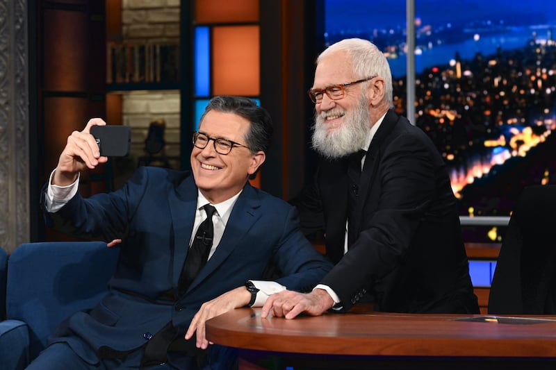 Colbert with his predecessor, David Letterman, during a November 2023 show