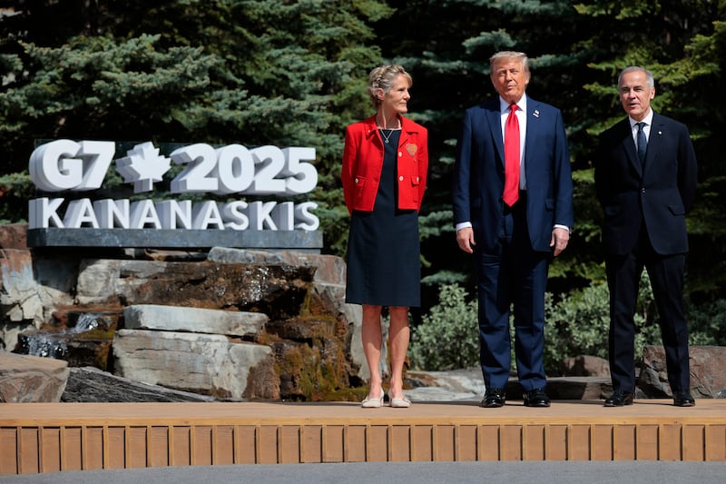 President Donald Trump  poses for a photo with Canadian Prime Minister Mark Carney and his wife Diana Fox Carney at the official welcome ceremony during the G7 Leaders' Summit on June 16, 2025 in Kananaskis, Alberta, Canada.