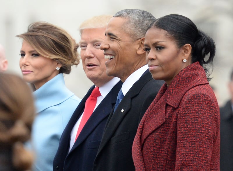 President Donald Trump (2nd-L) First Lady Melania Trump (L), former President Barack Obama (2nd-R) and former First Lady Michelle Obama walk together following the inauguration, on Capitol Hill in Washington, D.C. on January 20, 2017. President-Elect Donald Trump was sworn-in as the 45th President.