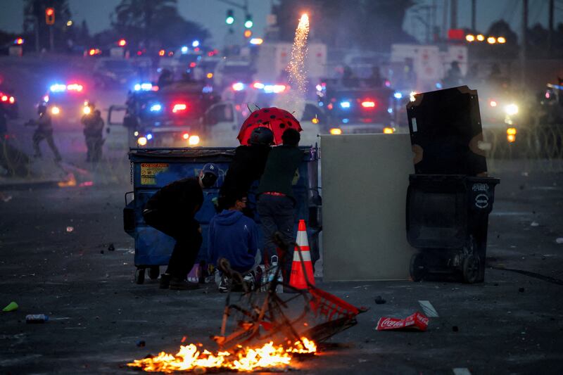 Crowds have launched fireworks at officers and started fires during the ugly clashes.