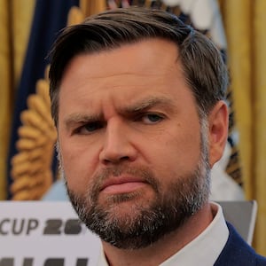 JD Vance looks at Donald Trump