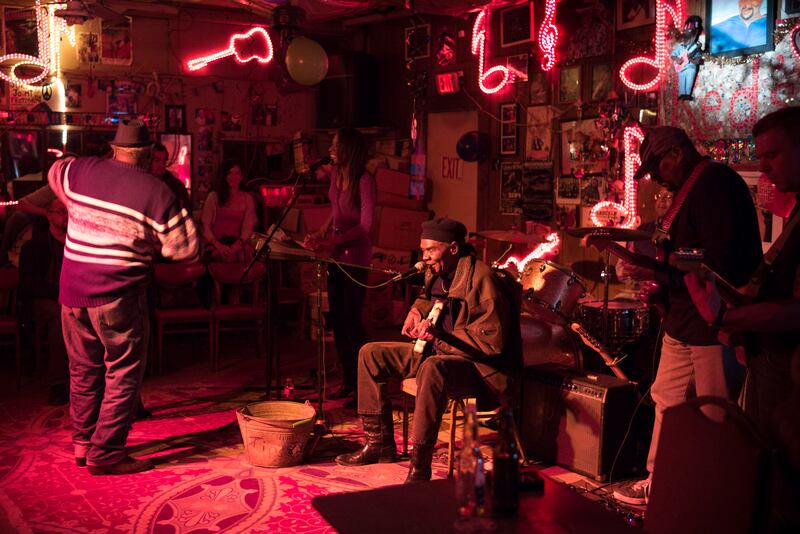 UNITED STATES - NOVEMBER 21: Blues band, guitarist, drums, vocals in live performance on stage at Red's Lounge Blues Club in Clarksdale, Mississippi, USA (Photo by Tim Graham/Getty Images)