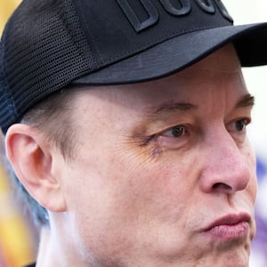 Elon Musk listens as President Donald Trump speaks to reporters in the Oval Office on May 30, 2025 in Washington, DC.