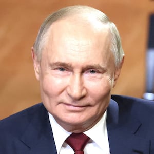 Vladimir Putin smiles during his meeting with students at the Siruis Education Center For Talented Children, May 18, 2025 in Sirius, Russia.