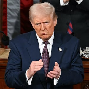 US President Donald Trump stands and applauds as he concludes his address to a joint session of Congress in the House Chamber of the US Capitol in Washington, DC, on March 4, 2025. (Photo by Jim WATSON / AFP) (Photo by JIM WATSON/AFP via Getty Images)