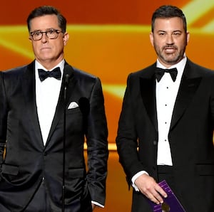 LOS ANGELES, CALIFORNIA - SEPTEMBER 22: Stephen Colbert and Jimmy Kimmel speak onstage during the 71st Emmy Awards at Microsoft Theater on September 22, 2019 in Los Angeles, California. (Photo by Amy Sussman/WireImage)