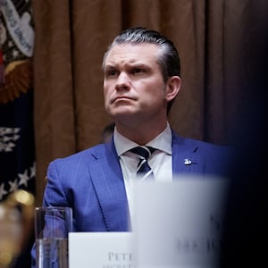 Donald Trump and Pete Hegseth appear during a Cabinet meeting at the White House on Feb. 25.