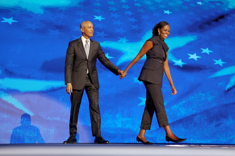 DNC CHICAGO, IL AUGUST 20, 2024  Former President Barack Obama and former first lady Michelle Obama on stage during the Democratic National Convention Tuesday, Aug. 20, 2024, in Chicago. (Robert Gauthier/Los Angeles Times via Getty Images)
