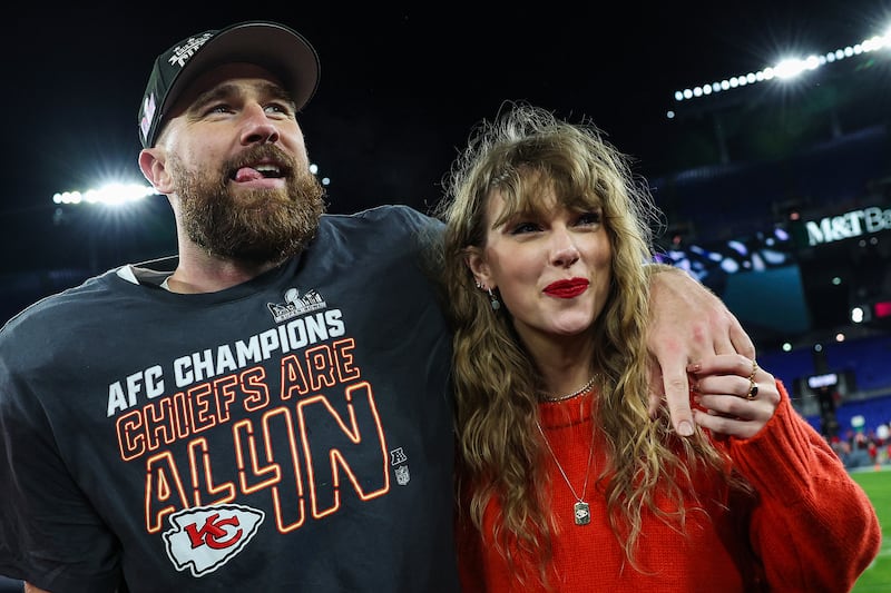 Travis Kelce of the Kansas City Chiefs celebrates with Taylor Swift.