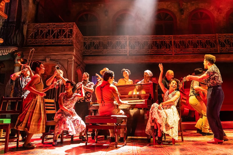 Leonardo Reyna (seated at piano) and the company of Buena Vista Social Club.