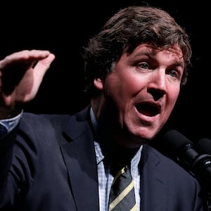 Tucker Carlson speaks at his Live Tour at the Desert Diamond Arena on October 31, 2024 in Phoenix, Arizona.