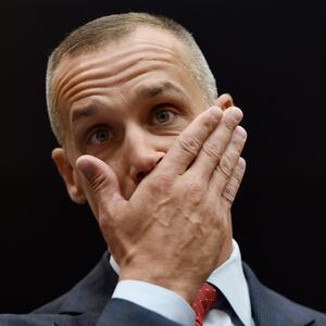 President Donald Trump's former campaign manager, Corey Lewandowski, looks on and covers his mouth with his hand before testifying before the House Judiciary Committee.