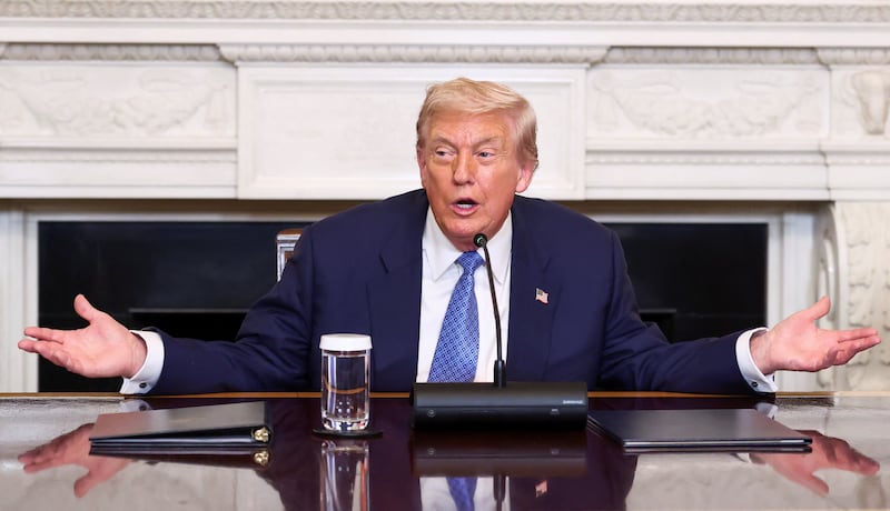 President Donald Trump gestures during a trilateral signing event at the White House, on August 8, 2025 where he said there would be some "swapping of territories" while answering questions about pushing for a peace deal in Ukraine.