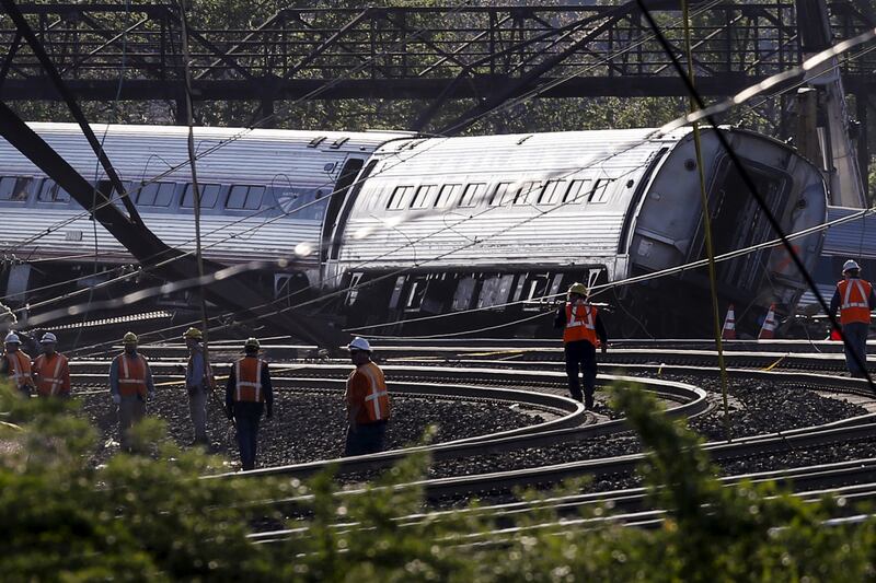 articles/2015/05/13/derailed-amtrak-cars-nearly-hit-bomb-train/150513-philadelphia-train1_xp3mkf