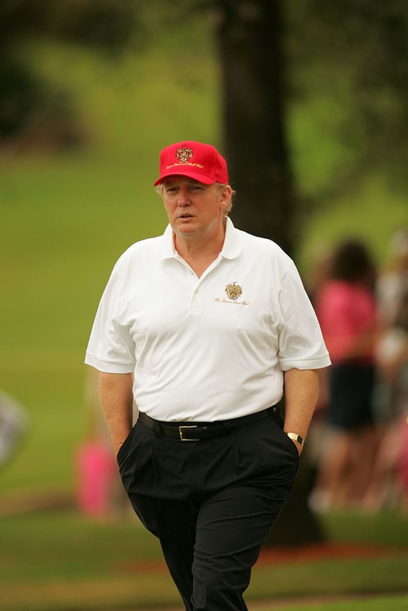 Donald Trump walks the course during a 2004 round at Trump International golf course in West Palm Beach, Florida.