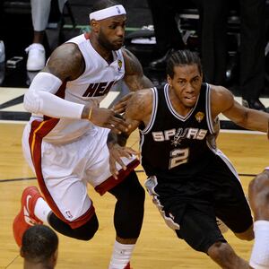 articles/2014/06/16/spurs-kawhi-leonard-is-named-nba-finals-mvp-on-father-s-day-six-years-after-his-dad-s-murder/140613-spurs-cheat_jgnelm