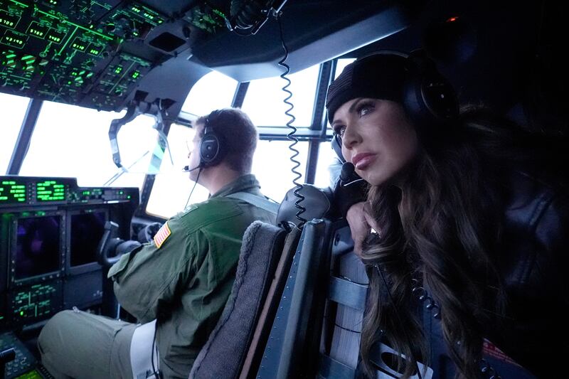 Noem looks out during an aerial tour from a U.S. Coast Guard Air Station.