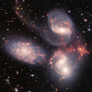 IN SPACE - JULY 12: In this handout photo provided by NASA, NASA's James Webb Space Telescope reveals Stephans Quintet, a visual grouping of five galaxies, in a new light on July 12, 2022 in space. This enormous mosaic is Webb's largest image to date, covering about one-fifth of the Moons diameter. It contains over 150 million pixels and is constructed from almost 1,000 separate image files. The information from Webb provides new insights into how galactic interactions may have driven galaxy evolution in the early universe.  (Photo by NASA, ESA, CSA, and STScI via Getty Images)