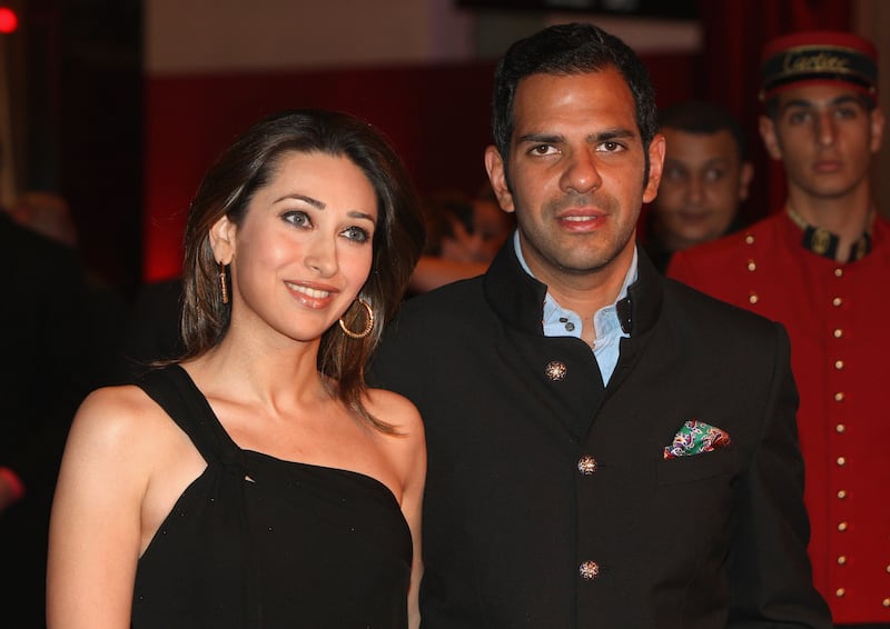 DUBAI, UNITED ARAB EMIRATES - MARCH 26:  Sanjay Kapur (R) and Karishma Kapur attend the inauguration of the new Cartier Boutique at Dubai Mall on March 26, 2009 in Dubai, United Arab Emirates. Today Cartier officially inaugurated its largest boutique in the Middle East in the prominent and lavish Dubai Mall. The boutique occupies a space of more than 700 m2 and is ranked among the top 5 largest flag-ship boutiques in the world.  (Photo by Chris Jackson/Getty Images for Cartier)