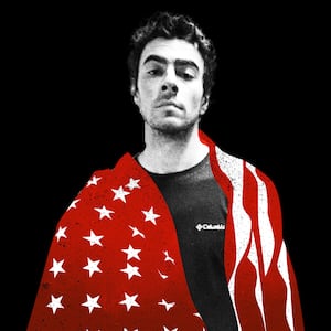 Luigi Mangione with red american flag draped over shoulders