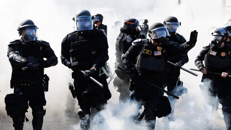 This picture taken on June 8, 2025 shows California Highway Patrol using smoke grenades to advance and push protestors off the 101 freeway during a demonstration following federal immigration operations in Los Angeles.