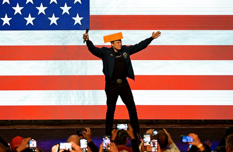 U.S. President Donald Trump's adviser Elon Musk wears a cheese hat as he holds a rally in support of a conservative state Supreme Court candidate of an April 1 election in Green Bay, Wisconsin, U.S. March 30, 2025.  REUTERS/Vincent Alban
