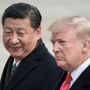 China's President Xi Jinping (L) and US President Donald Trump attend a welcome ceremony at the Great Hall of the People in Beijing.