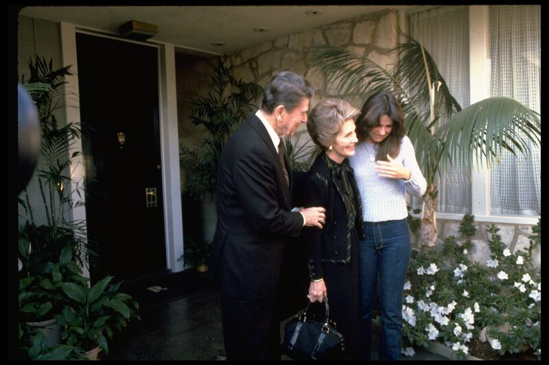 President-elect Ronald Reagan & wife Nancy say goodbye to daughter Patti as they leave their Pacific Palisades home for Washington DC.