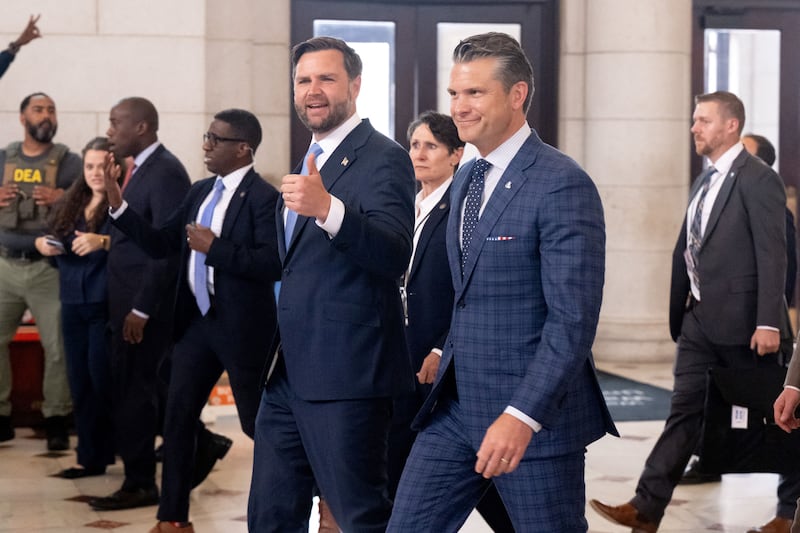 Vice President JD Vance and Defense Secretary Pete Hegseth react to protesters as they leave after greeting members of the National Guard stationed at Union Station in Washington, DC, on August 20, 2025.