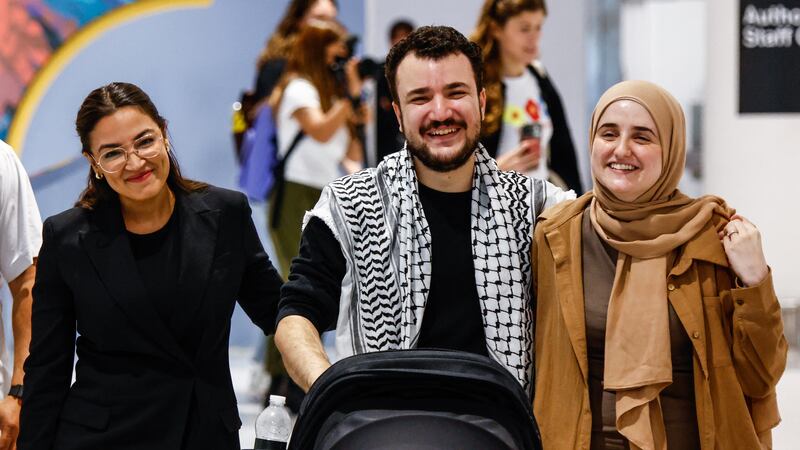 Mahmoud Khalil was released from detention on June 30 and reunited with his wife Noor Abdalla (R) and son, as well as U.S. Representative Alexandria Ocasio-Cortez (L), a champion of Khalil's in Congress.