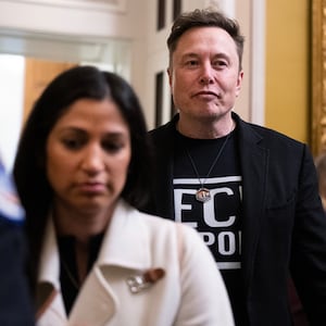 UNITED STATES - MARCH 5: Elon Musk, of the Department of Government Efficiency, leaves a lunch with senate Republicans in the U.S. Capitol on Wednesday, March 5, 2025. DOGE aide Katie Miller appears at left. (Tom Williams/CQ-Roll Call, Inc via Getty Images)