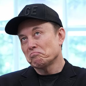Tesla CEO Elon Musk speaks alongside U.S. President Donald Trump to reporters in the Oval Office