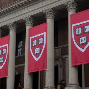 People walk past the Harry Elkins Widener Memorial Library on Harvard's campus on June 5, 2025.