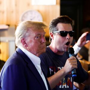 Rep. Matt Gaetz uses a microphone as Republican presidential candidate and former U.S. President Donald Trump campaigns at the Iowa State Fair in Des Moines, Iowa