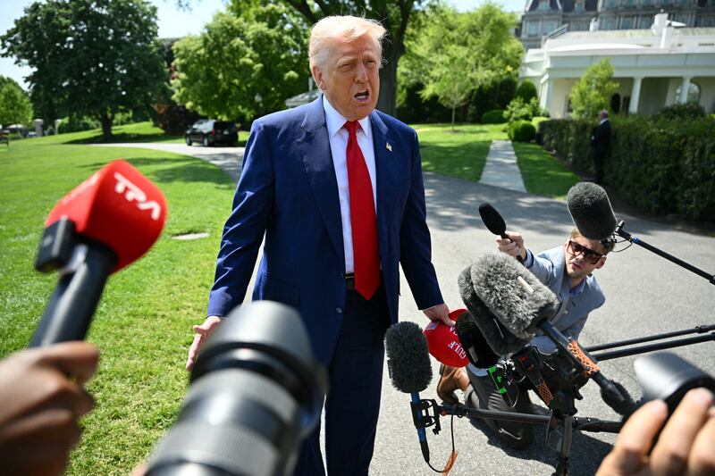 President Donald Trump praised billionaire Jeff Bezos before heading to Michigan on April 29 after Amazon scrapped a plan to display tariff costs for consumers.