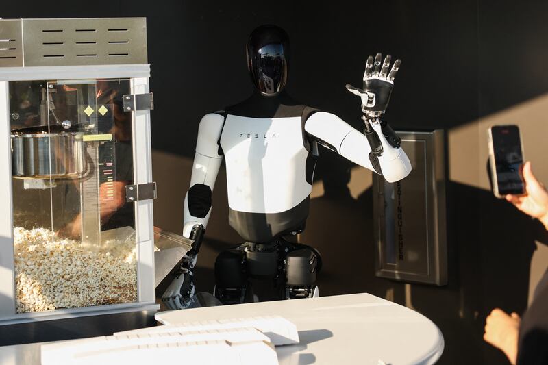 Optimus robots handed out popcorn to promote the Tesla Diner in Los Angeles last month.